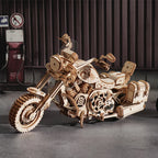 Wooden motorcycle model with mechanical details on a dark background