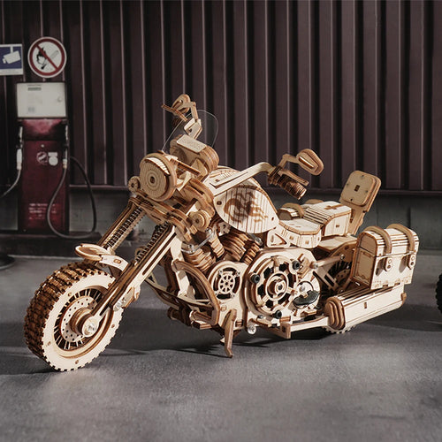 Wooden motorcycle model with mechanical details on a dark background