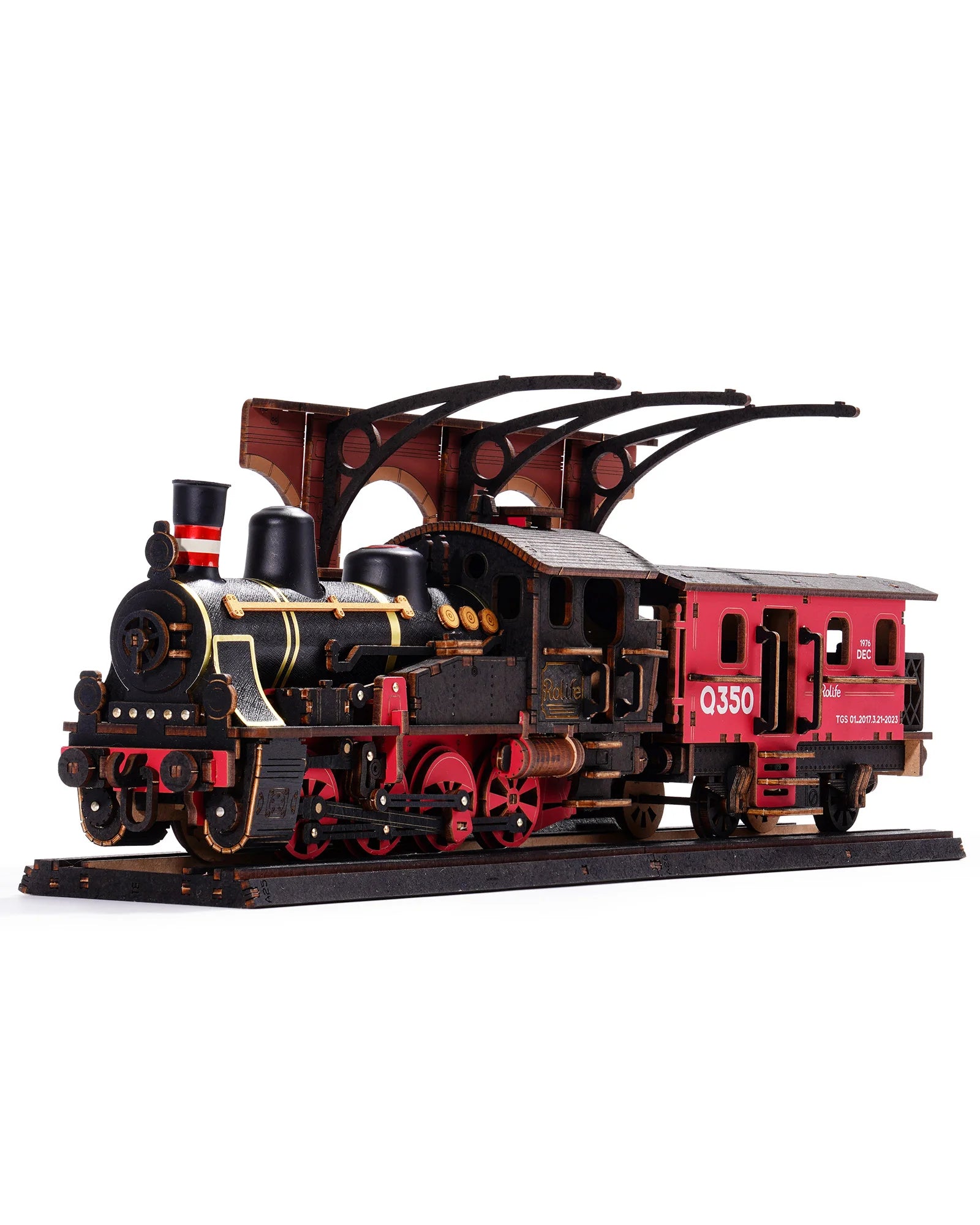 Model train set with a red car and black locomotive on a white background