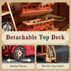 Wooden model of a London bus with detachable top deck, rolling wheels, and movable step ladder on a textured background.