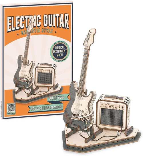 Wooden electric guitar and amplifier model kit with packaging in the background