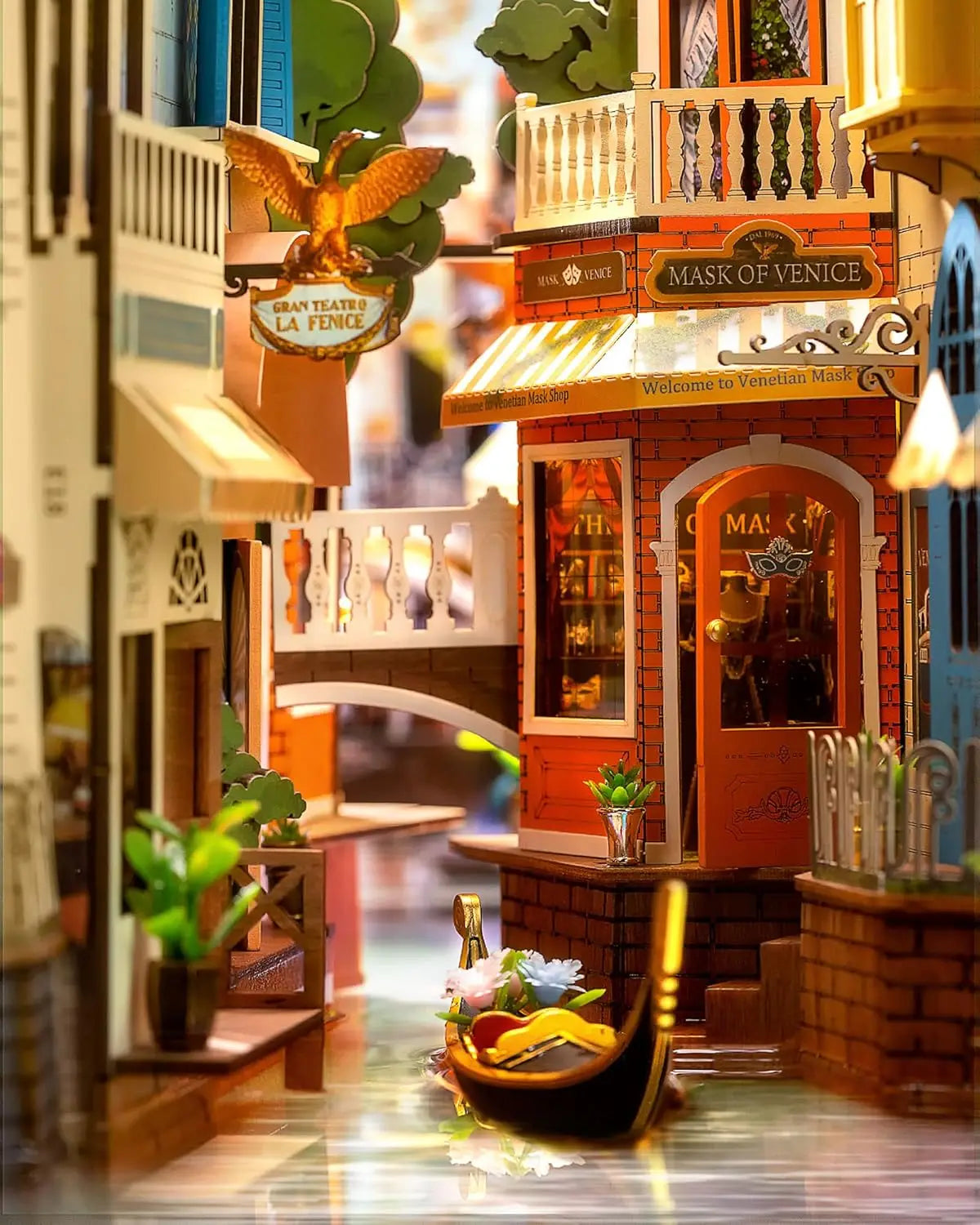 Miniature model of a Venice street with shops and a gondola.